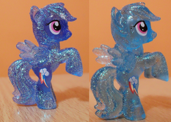 Size: 1280x915 | Tagged: safe, rainbow dash, pegasus, pony, g4, blind bag, female, figurine, glitter, irl, mare, photo, rearing, see-through, solo, sparkly hooves, sparkly mane, sparkly tail, sparkly wings, tail, toy, wings