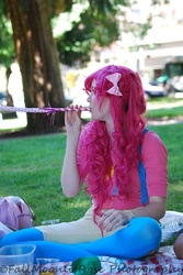 Size: 500x747 | Tagged: safe, artist:cookiecrisis, pinkie pie, human, g4, cosplay, grass, irl, irl human, overalls, party horn, photo, picnic, solo