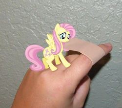 Size: 498x440 | Tagged: safe, fluttershy, human, pony, g4, bandaid, cute, finger, hand, irl, micro, photo, ponies in real life, real life background