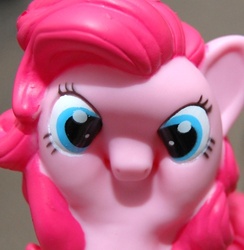 Size: 487x500 | Tagged: safe, pinkie pie, pony, g4, faic, irl, ponkie poy, reaction image, scrunchy face, solo, toy, wat
