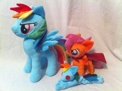 Size: 2592x1936 | Tagged: safe, artist:planetplush, rainbow dash, scootaloo, pegasus, pony, g4, beanie (plushie), button eyes, cape, clothes, cmc cape, female, filly, foal, folded wings, irl, lying down, mare, photo, plushie, prone, ragdoll, rainbow dash plushie, scootaloo plushie, smiling, spread wings, wings