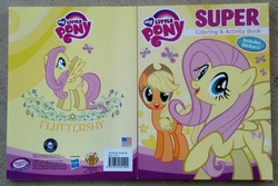 Size: 956x639 | Tagged: safe, applejack, fluttershy, pony, g4, official, coloring book, irl, merchandise, photo