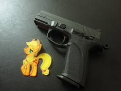 Size: 844x633 | Tagged: safe, applejack, g4, barely pony related, gun, patch