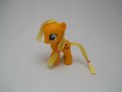Size: 4320x3240 | Tagged: safe, artist:tiellanicole, applejack, earth pony, pony, g4, brushable, customized toy, female, filly, irl, missing accessory, photo, solo, toy