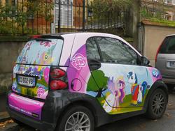 Size: 2580x1935 | Tagged: safe, fluttershy, princess cadance, rainbow dash, shining armor, g4, official, advertisement, car, france, photo, smart car, smart fortwo, tiji, tv station