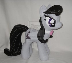 Size: 900x785 | Tagged: safe, artist:calusariac, octavia melody, earth pony, pony, g4, deviantart watermark, irl, obtrusive watermark, photo, plushie, solo, watermark