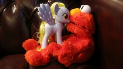 Size: 960x540 | Tagged: safe, derpy hooves, pegasus, pony, g4, background pony, crossover, crossover shipping, cute, derpabetes, duo, elmo, elmoderp, every day we stray further from god's light, fashion style, female, irl, male, mare, photo, sesame street, shipping, straight, toy, we are going to hell, what has humanity come to, what the fuck did you just bring upon this cursed land, why, wtf