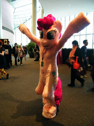 Size: 800x1067 | Tagged: safe, pinkie pie, human, g4, arms in the air, cosplay, fursuit, irl, irl human, photo, ponysuit, solo focus