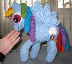 Size: 1320x1172 | Tagged: safe, artist:skookyspry, rainbow dash, pegasus, pony, g4, amigurumi, crochet, female, hand, irl, mare, photo, plushie, solo