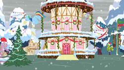 Size: 1600x900 | Tagged: safe, artist:evil-dec0y, derpy hooves, rainbow dash, pegasus, pony, g4, christmas, christmas lights, duo, duo female, female, mare, mouth hold, ponyville, ponyville town hall, scenery, snow, snowfall, tied up, town hall