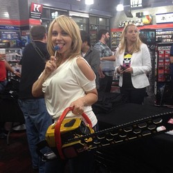Size: 612x612 | Tagged: safe, human, barely pony related, chainsaw, female, irl, irl human, lollipop, lollipop chainsaw, male, photo, tara strong, voice actor