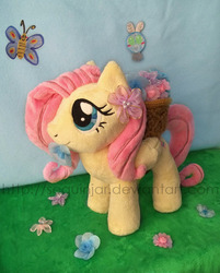 Size: 600x747 | Tagged: safe, artist:sequinjar, fluttershy, butterfly, parasprite, pony, g4, cute, flower, flower in mouth, irl, mouth hold, photo, plushie