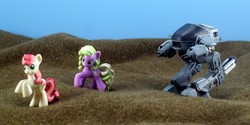 Size: 1800x900 | Tagged: safe, artist:seanmonster, daisy, flower wishes, roseluck, g4, ed-209, irl, photo, robocop, toy