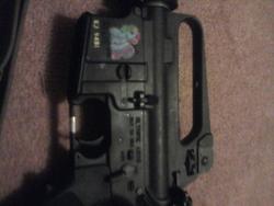 Size: 640x480 | Tagged: safe, rainbow dash (g3), g3, ar-15, customized toy, gun, gunified, irl, my little arsenal, rifle, sticker