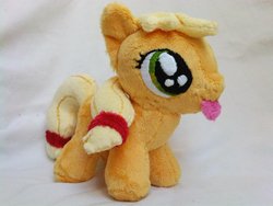 Size: 1024x768 | Tagged: safe, artist:caashley, applejack, earth pony, pony, g4, female, filly, irl, photo, plushie, silly, silly pony, solo, tongue out, who's a silly pony