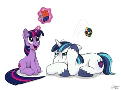 Size: 1500x1113 | Tagged: safe, artist:psychodikdik, shining armor, twilight sparkle, pony, unicorn, g4, brother and sister, duo, duo male and female, female, filly, filly twilight sparkle, magic, male, mare, prone, rubik's cube, siblings, simple background, sitting, stallion, unicorn twilight