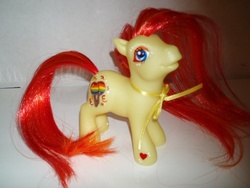 Size: 640x480 | Tagged: safe, artist:thelovecat, fiesta flair, earth pony, pony, g3, 2007, customized toy, female, irl, mare, neck bow, photo, solo, toy