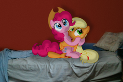 Size: 1600x1064 | Tagged: safe, artist:stupidlittlecreature, artist:supernatural90, applejack, pinkie pie, earth pony, pony, g4, accessory swap, bed, caught, embrace, female, irl, kissing, lesbian, mare, photo, ponies in real life, ship:applepie, shipping