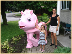 Size: 583x437 | Tagged: safe, pinkie pie (g3), earth pony, human, pony, g3, costume, female, irl, irl human, jesus christ how horrifying, lidded eyes, outdoors, photo, ponies in real life, ponysuit, trio, trio female, uncanny valley, woman