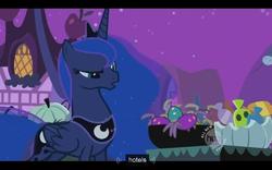 Size: 640x400 | Tagged: safe, screencap, princess luna, alicorn, pony, g4, luna eclipsed, candy, crown, curious, ethereal mane, female, flowing mane, folded wings, food, jewelry, mare, night, nightmare night, plushie, ponyville, pumpkin, raised eyebrow, regalia, solo, sparkling mane, toy, wings, youtube caption