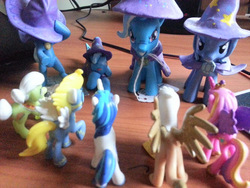 Size: 640x480 | Tagged: safe, gilda, granny smith, princess cadance, shining armor, surprise (g4), trixie, griffon, g4, blind bag, irl, multeity, photo, toy, trixie army, trixie's cape, trixie's hat, wonderbolts