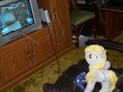 Size: 600x450 | Tagged: safe, artist:eratosofcyrene, derpy hooves, pegasus, pony, g4, female, gamecube, irl, mare, metroid, metroid prime, photo, plushie, samus aran, video game, wii