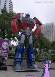 Size: 445x621 | Tagged: safe, twilight sparkle, pony, g4, irl, optimus prime, photo, ponies in real life, san diego comic con, the hub, transformers, vector