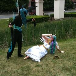 Size: 1530x1533 | Tagged: safe, artist:diamondxfire, artist:markaged, princess celestia, queen chrysalis, human, g4, anime north, anime north 2012, cosplay, duo, fight, irl, irl human, photo