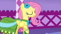 Size: 934x525 | Tagged: safe, screencap, fluttershy, pegasus, pony, g4, my little pony: friendship is magic, suited for success, clothes, dress, eyes closed, female, gala dress, scrunchy face, solo