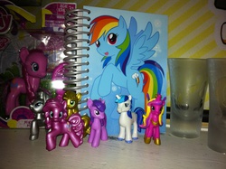 Size: 2592x1936 | Tagged: safe, applejack, pinkie pie, princess cadance, rainbow dash, rarity, shining armor, twilight sparkle, g4, blind bag, collection, figure, irl, notebook, photo, toy