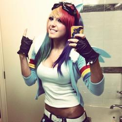 Size: 960x960 | Tagged: source needed, safe, rainbow dash, human, g4, breasts, cleavage, clothes, cosplay, female, goggles, irl, irl human, jessica nigri, midriff, photo, selfie, solo, tank top