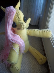 Size: 3000x4000 | Tagged: safe, artist:charletothemagne, fluttershy, pegasus, pony, g4, button eyes, creepy, female, irl, mare, photo, plushie, sitting, spread arms, stitched body