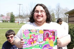 Size: 1600x1066 | Tagged: safe, pinkie pie, rarity, chipmunk, human, g4, brony, brony of happiness, brony stereotype, brushable, friendship express, glasses, hub logo, hubble, irl, irl human, male, neckbeard, photo, stereotype, toy, train