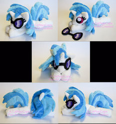 Size: 1024x1100 | Tagged: safe, artist:catnapcaps, dj pon-3, vinyl scratch, pony, unicorn, g4, beanie (plushie), glasses, horn, irl, lying down, multiple views, photo, plushie, prone, solo, squeaky