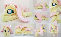 Size: 900x547 | Tagged: safe, artist:catnapcaps, fluttershy, pony, g4, beanie (plushie), irl, photo, plushie, solo, squeaky