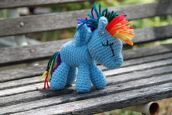 Size: 900x600 | Tagged: safe, artist:craftedkansas, rainbow dash, pegasus, pony, g4, amigurumi, bench, crochet, doll, irl, outdoors, photo, plushie, solo, spread wings, toy, wings