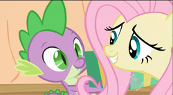 Size: 853x469 | Tagged: safe, screencap, fluttershy, spike, dragon, pegasus, pony, g4, secret of my excess, all new, female, golden oaks library, grin, hub logo, logo, male, mare, present, smiling, text, the hub