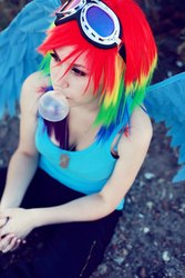 Size: 682x1024 | Tagged: safe, artist:erinliona, rainbow dash, human, g4, bubblegum, cleavage, cosplay, female, food, gum, irl, irl human, multicolored hair, photo, rainbow hair, solo