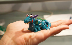 Size: 900x570 | Tagged: safe, artist:archaleo, crackle, dragon, human, g4, customized toy, hand, irl, photo