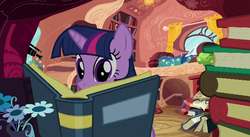 Size: 640x350 | Tagged: safe, screencap, twilight sparkle, pony, unicorn, g4, spike at your service, book, golden oaks library, open book, pile of books, reading, unicorn twilight