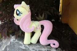 Size: 900x600 | Tagged: safe, artist:caleighs-world, fluttershy, pegasus, pony, g4, doll, irl, outdoors, photo, plant, plushie, solo, toy