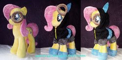 Size: 1280x630 | Tagged: safe, artist:agatrix, fluttershy, pegasus, pony, g4, accessory, bunny ears, clothes, costume, dangerous mission outfit, female, goggles, hoodie, irl, mare, photo, plushie, solo
