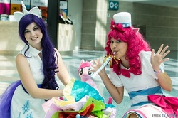 Size: 500x332 | Tagged: safe, artist:maxpowercosplay, artist:rmtakesover, artist:unkcos8, pinkie pie, rarity, human, g4, anime expo, clothes, cosplay, dress, gala dress, irl, irl human, party cannon, party horn, photo
