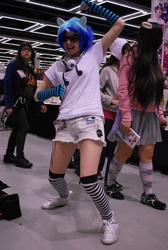 Size: 1944x2896 | Tagged: safe, artist:gengargirlcat, artist:nepetas-catnip-stash, dj pon-3, vinyl scratch, human, g4, clothes, convention, cosplay, evening gloves, headphones, irl, irl human, photo, sakura con, shorts, socks, striped socks