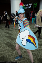 Size: 1365x2048 | Tagged: safe, artist:dtjaaaam, rainbow dash, human, g4, action pose, armor, cosplay, irl, irl human, palindrome get, photo, sakura con, shield, sword, weapon