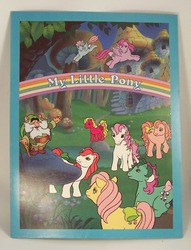 Size: 551x721 | Tagged: safe, photographer:kisscurl, baby shady, cherries jubilee, fizzy, heart throb, moochick, paradise, posey, truly, wind whistler, g1, my little pony 'n friends, cottage, folder, merchandise, mushroom, rainbow