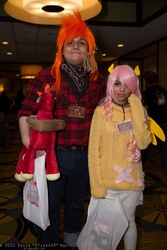 Size: 1365x2048 | Tagged: safe, artist:dtjaaaam, big macintosh, fluttershy, human, g4, anime los angeles, bandana, clothes, convention, cosplay, female, irl, irl human, male, photo, plushie, ship:fluttermac, shipping, straight, sweater, sweatershy