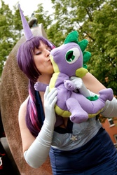 Size: 1068x1600 | Tagged: safe, artist:eternal--moon, spike, twilight sparkle, human, g4, clothes, cosplay, dress, evening gloves, female, gala dress, irl, irl human, kissing, male, merch kissing, outdoors, photo, plushie, shipping, solo, spike plushie, straight