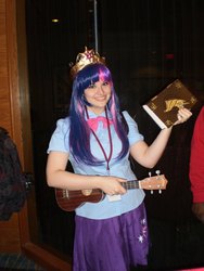 Size: 720x960 | Tagged: safe, artist:shelbeanie, twilight sparkle, human, equestria girls, g4, banzaicon, book, book of harmony, cosplay, irl, irl human, musical instrument, photo, solo, ukulele