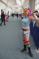 Size: 3264x4928 | Tagged: safe, artist:geekeryandsuch, rainbow dash, human, g4, belly button, big breasts, breasts, busty rainbow dash, cosplay, flexing, irl, irl human, midriff, photo, rainboob dashie ali